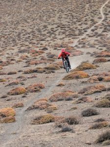 Mountain biker on the amazing single trail to Lupra in Lower Mustang on the Annapurna circuit in Nepal