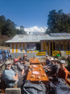 Group having a tea stop at Chauli Kharka, Manaslu north 7157m can been soon in the background. Manaslu circuit trail in Nepal