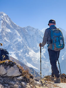 Trekker heading from Ponkar Tal to Bimthang on the Manaslu Circuit trek in Nepal